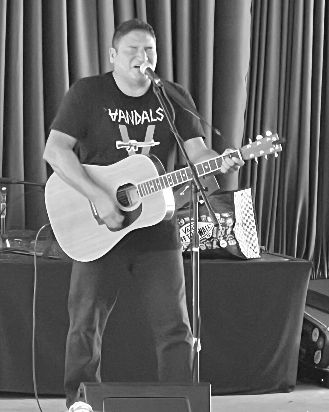 Tom Reyes performing live with acoustic guitar